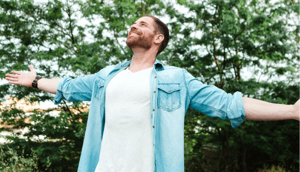 carefree-free-man-raising-his-arms-1