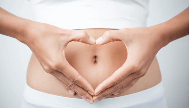 close-up-woman-s-hands-made-heart-belly-1